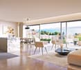 Open plan living and dining area with large windows, modern kitchen, wooden floor, large rug, modern furniture, fireplace, view of the sea