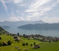 Lake and mountains in the distance, houses, fields