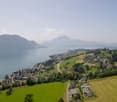 Lake, mountains, village, houses, road, fields, swimming pool