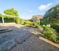 stone pathway, gravel, plants, trees, bushes, pergola