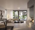 Open-concept living room with large windows overlooking a garden, a fireplace, a modular sofa, a coffee table, and a dining area with a wooden table and chairs