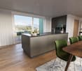 Modern kitchen with a large island, wooden floors, large windows with a view of the terrace, white curtains, and modern appliances.