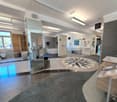 modern design, tiled floor, shower, bathtub, sinks, glass walls, decorative items