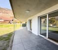 modern building with glass facade and balcony, white walls, concrete ceiling, glass floor, tiled pavement