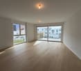 empty room, wooden floor, white walls, large windows, sliding glass doors, balcony