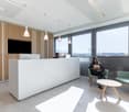 modern office interior, white desk, chairs, pendant lights, windows