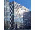 Modern office building with glass facade, 56 floors, located in a city center