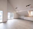 empty kitchen area with sliding doors to balcony, wooden ceiling