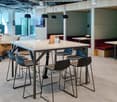 tables with chairs, benches, books on shelves, light fixtures
