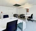 modern office, white walls, white desks, black chairs, gray armchairs, white radiator, picture frame, white ceiling