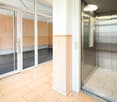 elevator, glass doors, wooden floor, mailbox