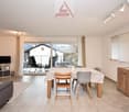 balcony, dining table, chairs, tv stand, cupboard, couch, wooden floor