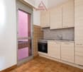 kitchen with oven, sink, cabinets, tiled floor, glass door