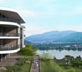 Modern apartment building, balconies, scenic lake view, nearby mountains, greenery landscape