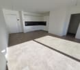Empty room, white walls, tiled floor, modern kitchen design, overhead lighting