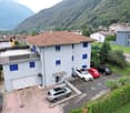 4 cars parked, balcony, garage, red tiled roof, 4 bedrooms