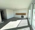 modern kitchen with white cabinets, wooden countertop, stainless steel appliances, large windows, balcony