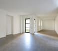 Empty room, white walls, tiled floor, glass doors, no furniture