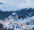 Snow-covered mountainous area with buildings