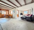wooden ceiling, wooden floor, fireplace, large windows, dining table, couch, television