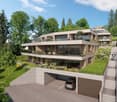 Modern multi-story house with multiple balconies, raised ground floor, and garage