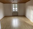 empty room, wooden floor, white walls, window, radiator