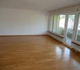empty room, wooden floor, white walls, large windows, balcony