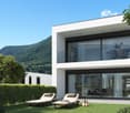 Contemporary white modern house, floor to ceiling glass windows, lounge chairs, balcony, well maintained garden