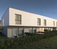Modern two-story house, raised ground floor, large glass windows, outdoor seating area, manicured garden, trees, birds flying