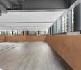 Open corridor, with large windows, glass walls, hardwood floors, exposed ceiling with metal beams