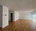 empty room, wooden floor, white walls, glass door, power outlets, light switch