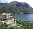 Large house with several terraces, lake view, green roof, green surroundings