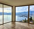 large glass windows, wooden floor, balcony, city and lake view