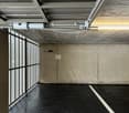 parking garage, concrete wall, metal gate, floor number 05