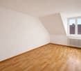 empty room, wooden floor, white walls, window, radiator