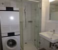 washer, dryer, shower, sink, mirror