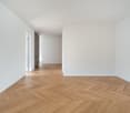 empty room, wooden floor, white walls, decorative wall, hallway