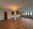 empty room, wooden floor, white walls, two doors, windows with blinds, ceiling lights