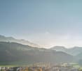 Aerial view of landscape with mountains, valley, town