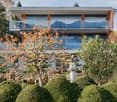 Modern 2 story house, large glass windows, balcony, Japanese garden, trees