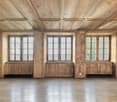 wooden ceiling, wooden walls, hardwood floor, large windows