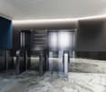 modern design with gray and blue accents, automated glass doors, marble flooring, sleek aesthetic