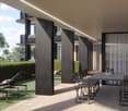 Outdoor dining area with table and chairs, lounge chairs, and a hedge