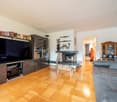 hardwood floor, flat screen tv, built-in cabinet, fireplace, sofa, couch