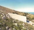 Contemporary building on a hillside with a stunning view of the sea