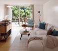 large sofa, coffee table, floor lamp, wooden floor, white walls, balcony, dining table, chairs, trees view