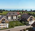 Residential building with modern design, rooftop terrace, wooden facade, green rooftop, spacious balconies, several units