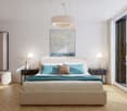 Bedroom with wooden floor, large bed, nightstands, lamps, wardrobe, mirror, balcony, painting, and scenic view