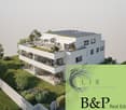 Two-story house, white exterior, solar panels on the roof, multiple balconies, garden area with a rooftop terrace, greenery, and outdoor seating