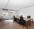 empty room, wooden floor, white walls, large windows, office table, office chairs